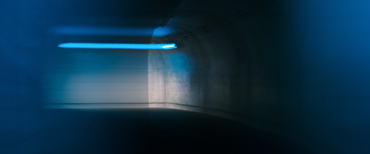 Abstract blue light streaks in dark space